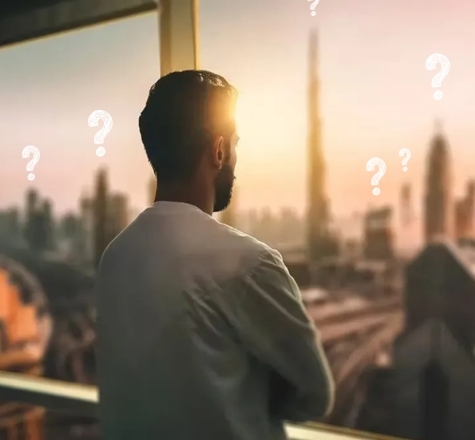 Person looking at Dubai skyline with question marks